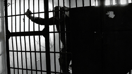 prisoner-in-a-cell-1168x440px.jpg 1