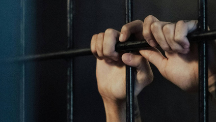 hands-of-jailed-person-1168x440px.jpg