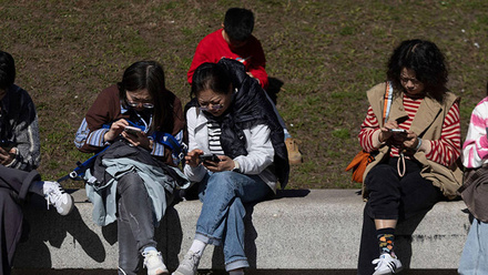 people-looking-at-phone-1168x440px.jpg