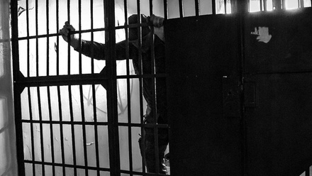 prisoner-in-a-cell-1168x440px.jpg