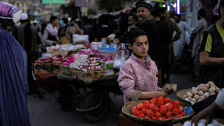 boy-standing-at-dyed-eggs-market-stall-in-downtown-Kabul-women-and-men-passing-by-1168x440.jpg 1